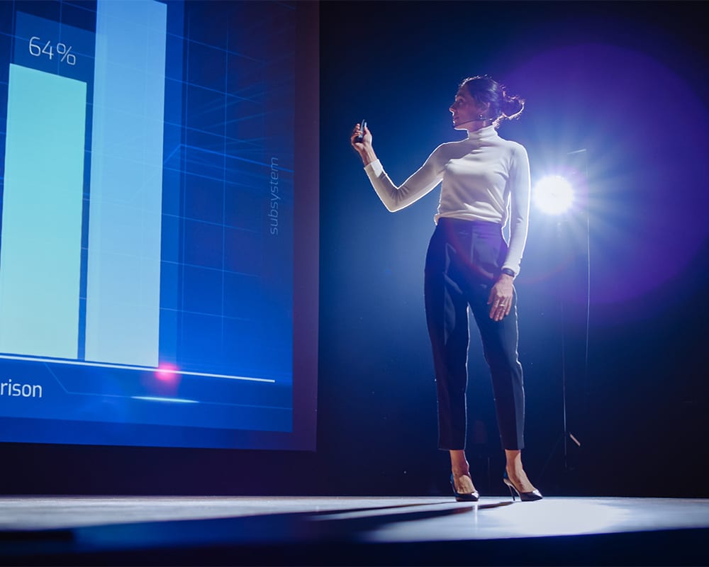 Woman presenting on a stage