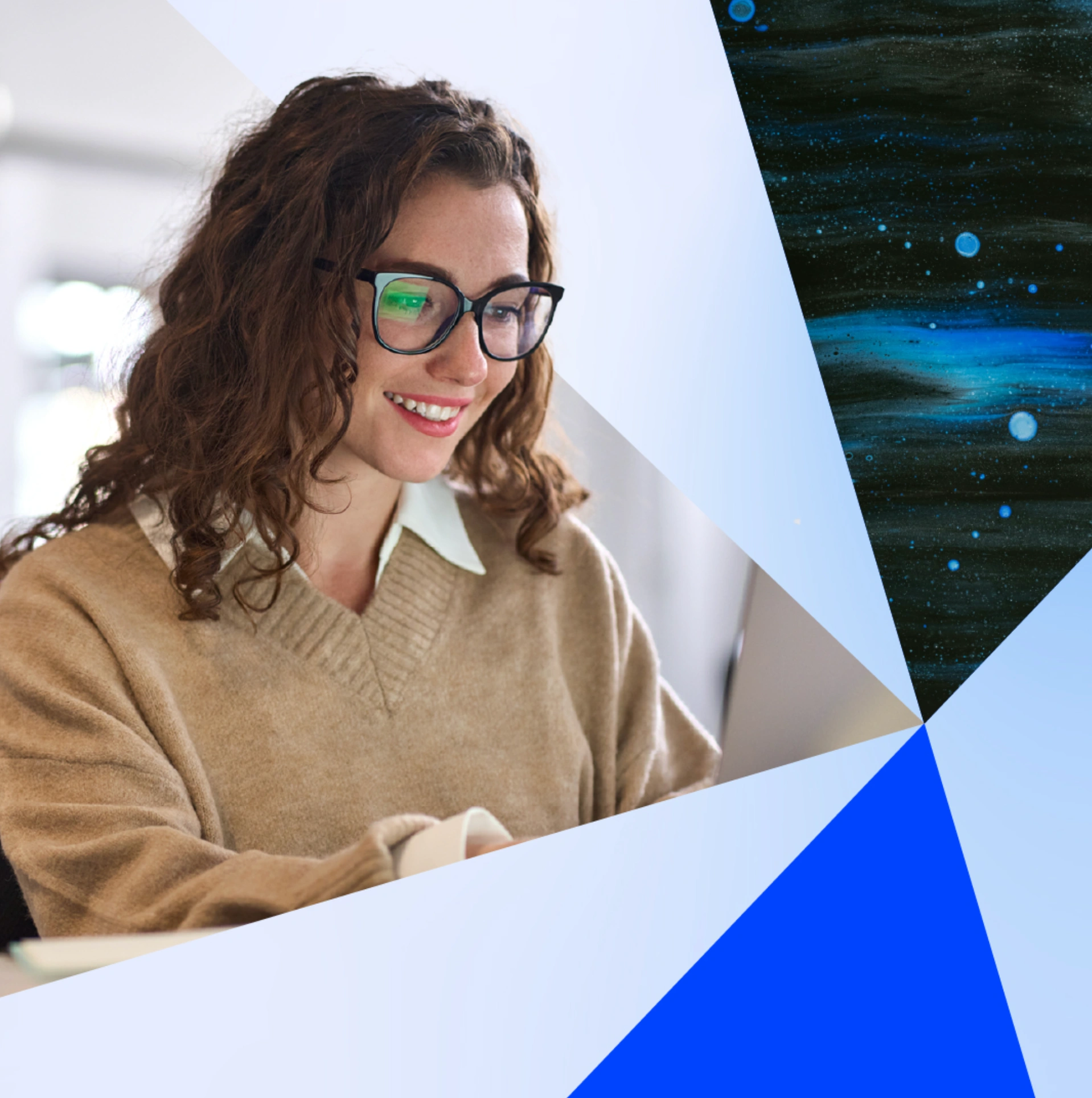 Smiling woman with curly hair wearing glasses and a beige sweater, working on a laptop, with abstract blue and white geometric shapes in the background.